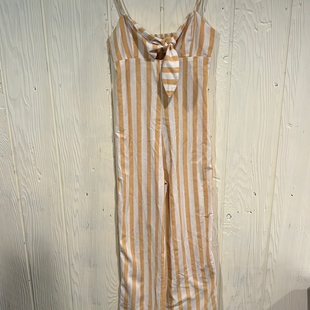 Cisono jumpsuit with tie peek at breast size Medium
